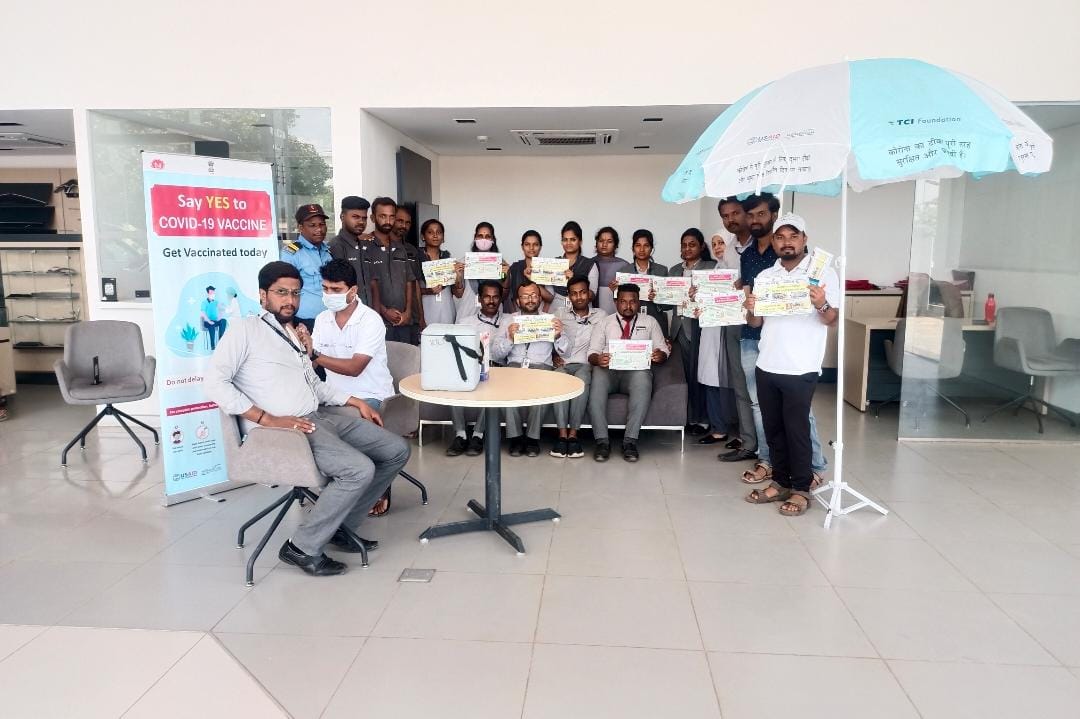 vijayapura health department gives covid doses to KIA Showroom staff